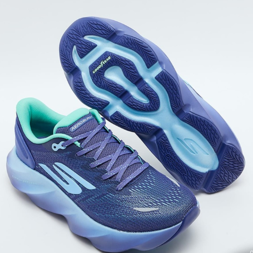 Blue running shoes with a white sole on a light gray background