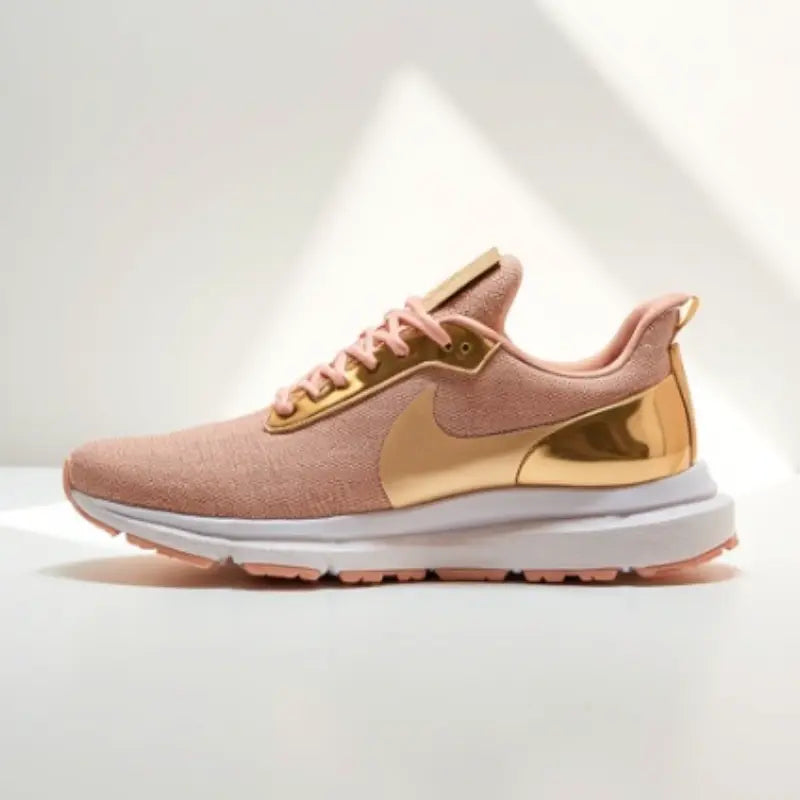 Pink and gold sneaker with white sole on a light gray background