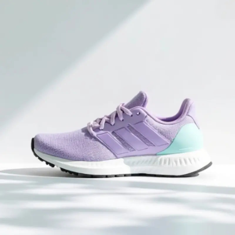 Purple Adidas sneaker on a light gray background
