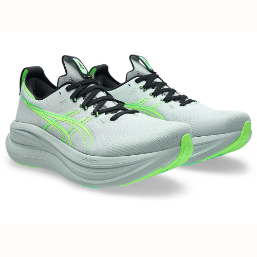Light gray running shoes with green accents on a white background