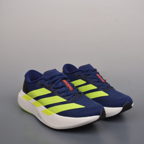Blue and green running shoes with white soles on a gray background