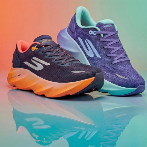 Two running shoes, one purple and one blue with orange sole, on a reflective surface.