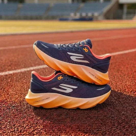 Navy and orange running shoes on a track